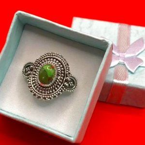 Intricate Silver Ring with Green Stone